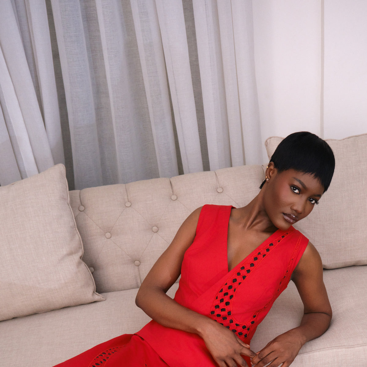 Model wearing the villea set with diamond embroidery detail,editorial seated pose